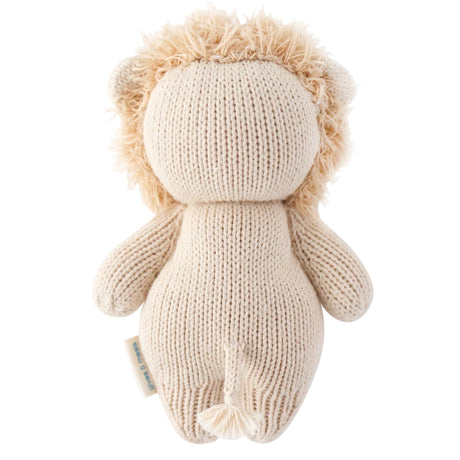 Knitted lion toy with beige mane on a white background