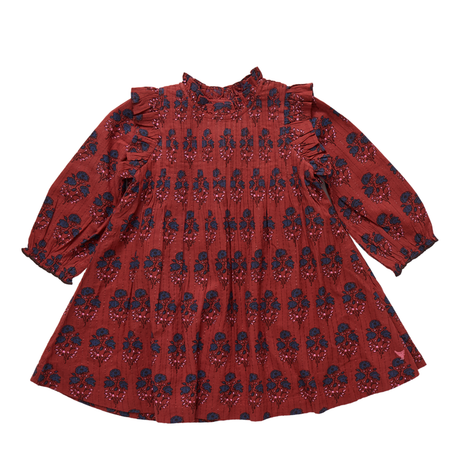 Red dress with blue floral pattern on a white background