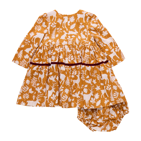 Children's outfit with a mustard yellow and white pattern on a white background
