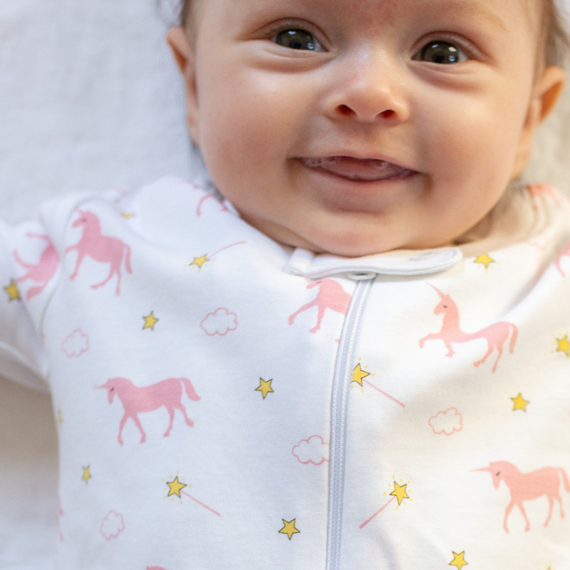 a baby wearing Magical Unicorn Zipper Romper 1
