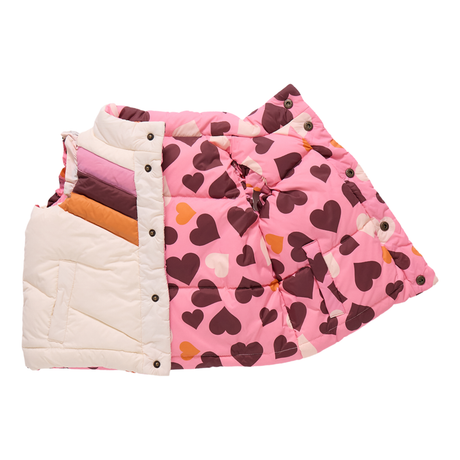 Pink quilt with heart pattern on a white background