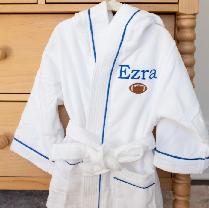 Monogrammed robe hanging in bedroom