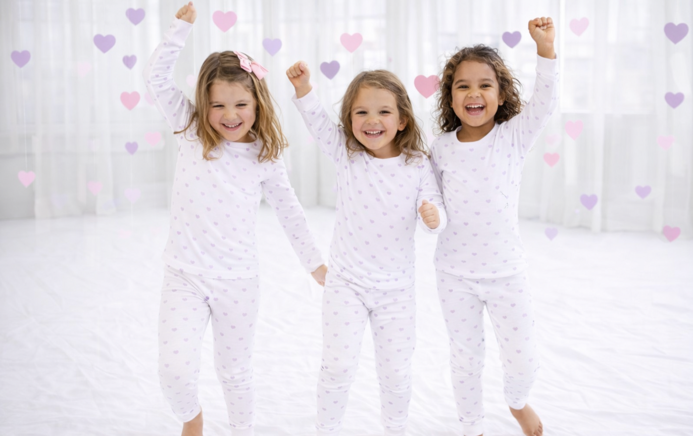 Girls in their heart pjs in a studio dancing