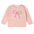 Pink knitted sweater with a bow design on a white background