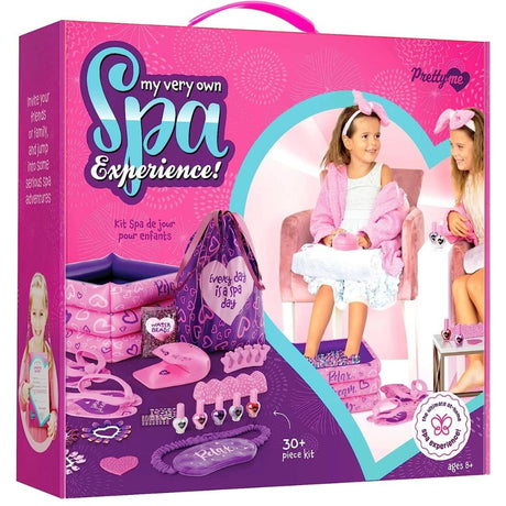 Toy spa experience set packaging with pink and purple design, featuring dolls and spa accessories.