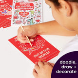 Person using a paintbrush to scratch off a Valentine's Day card with hidden pictures.