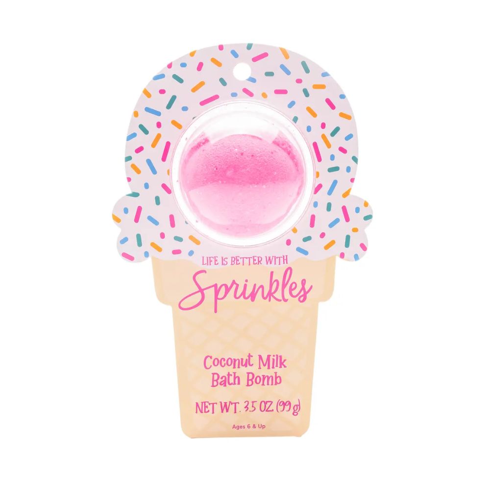 Pink bath bomb in a donut-shaped container with sprinkles on a white background