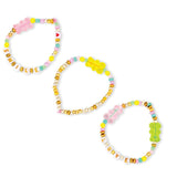 Set of colorful beaded hair accessories on a white background