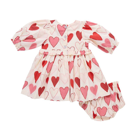 Children's outfit with heart pattern on a white background
