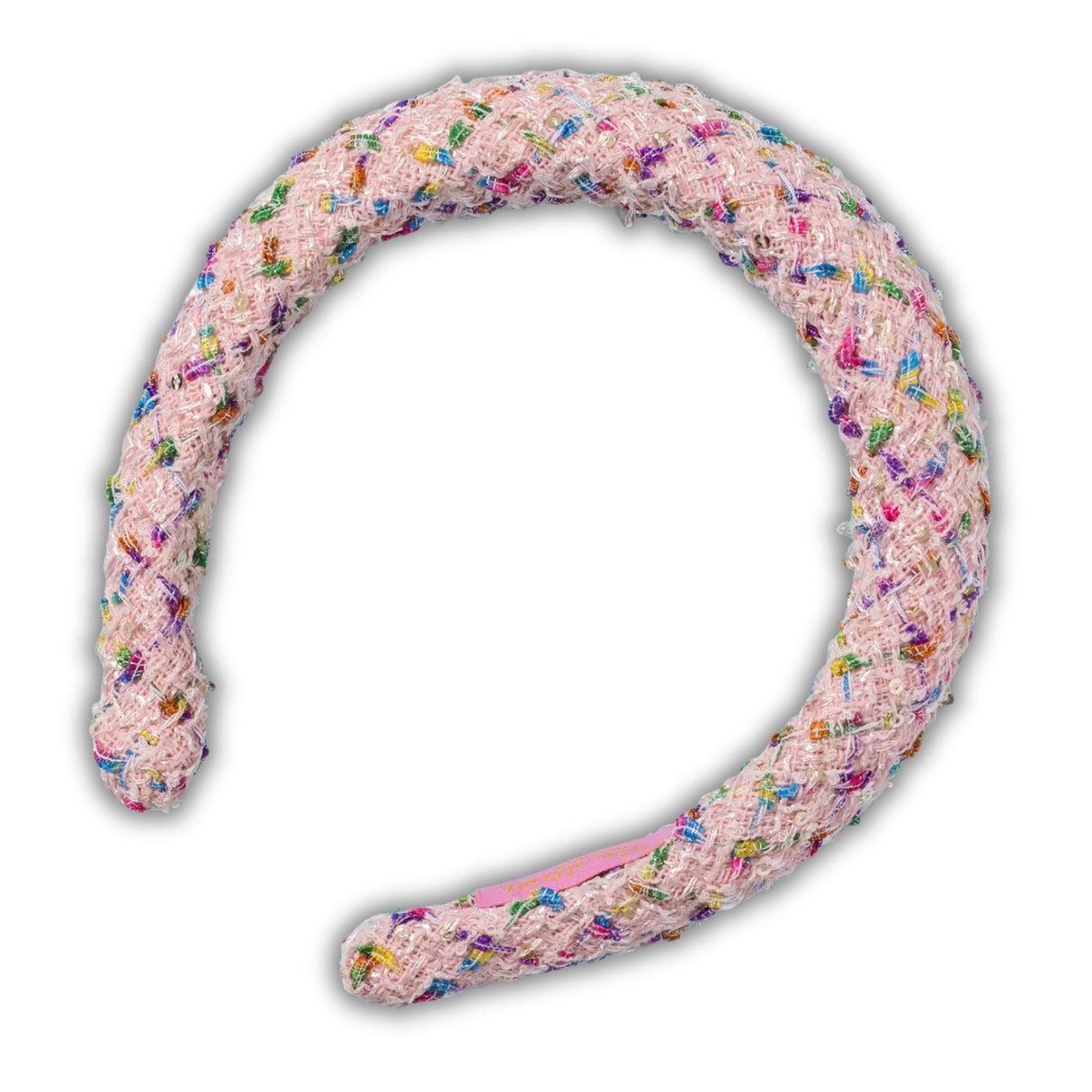 Pink chew toy with colorful sprinkles on a white background