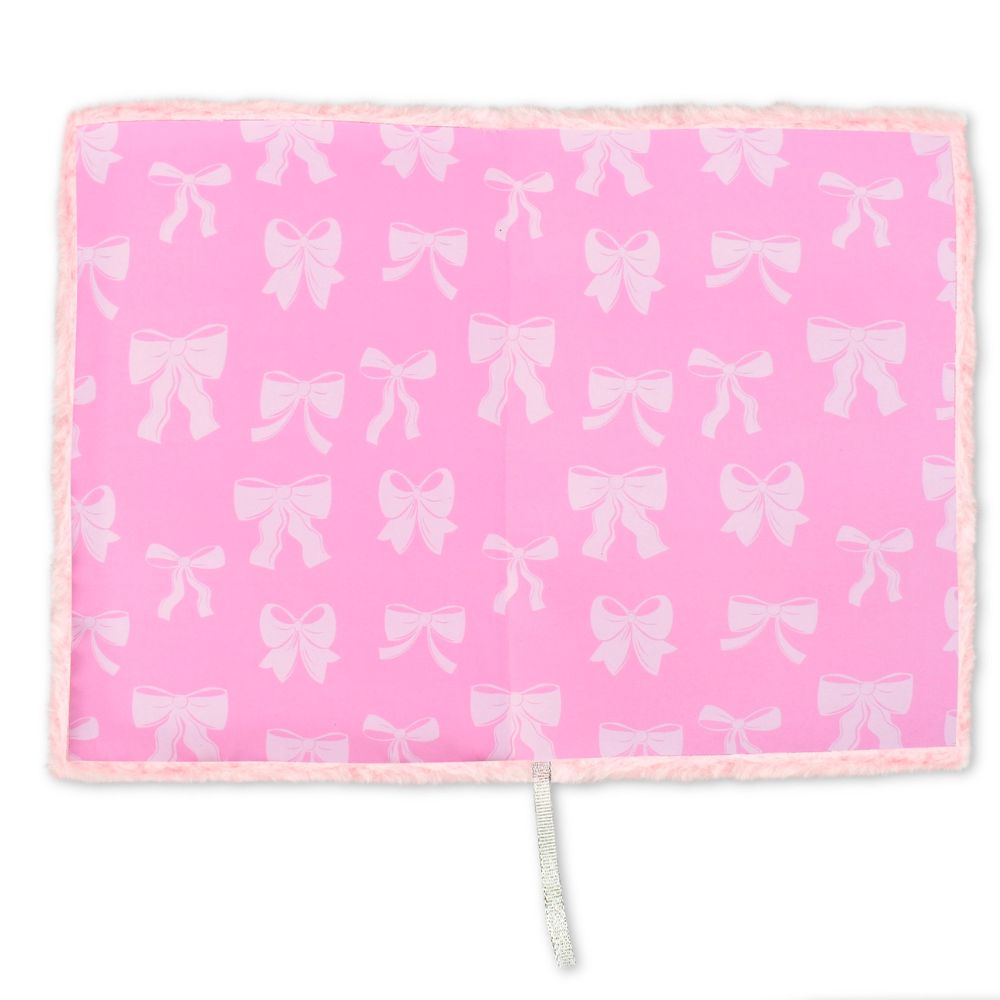 Pink blanket with white bow pattern on a white background