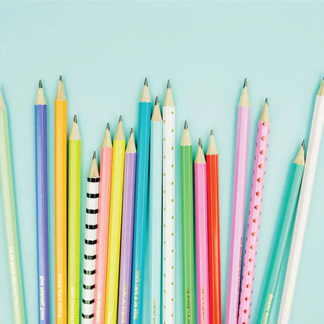 Assorted colorful pencils on a light blue background