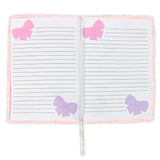 Notebook with pink and purple bows on a white background