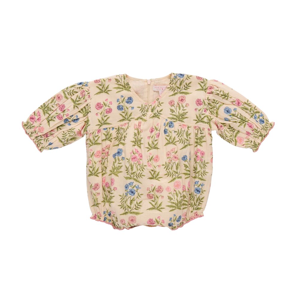 Floral-patterned baby romper on a white background