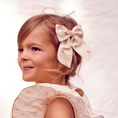 a little girl wearing Audrey Alligator Clip in Multi Muted Flowers