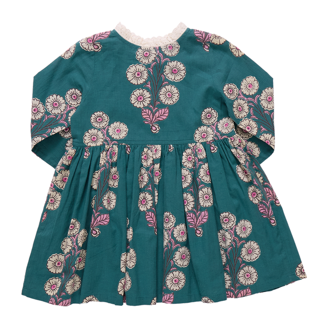 Teal dress with floral patterns on a white background