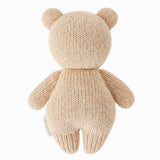Knitted teddy bear toy on a white background