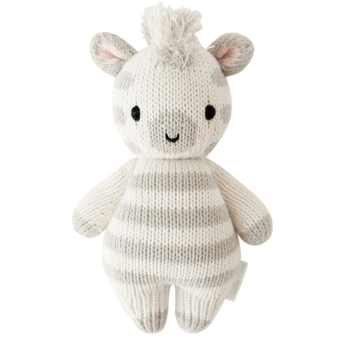 Knitted toy zebra with a white and gray striped body on a white background