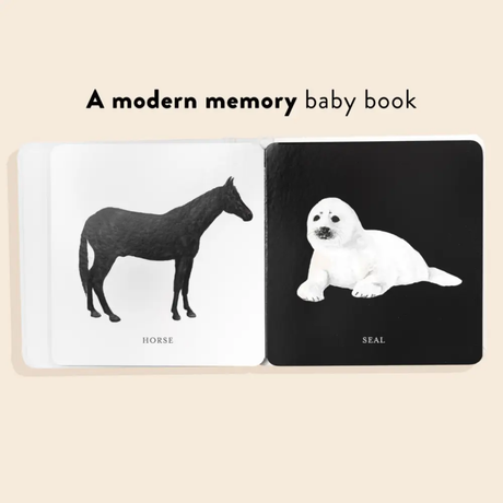 Baby book with illustrations of a horse and a seal on a beige background