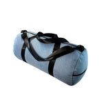 Blue duffel bag with black straps on a white background