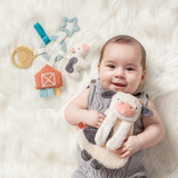 Bitzy Busy Gift Set a baby holding stuff toy