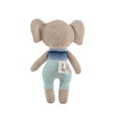 Knitted toy elephant with a blue and brown outfit on a white background
