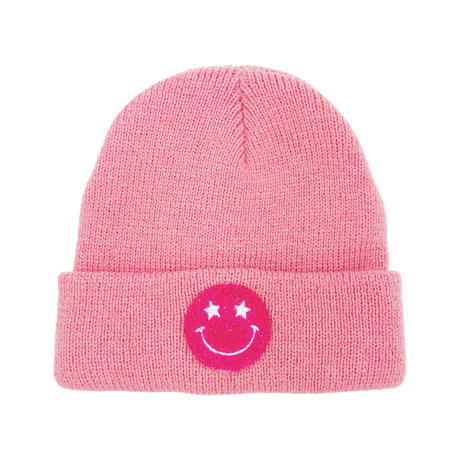 Pink beanie with a smiley face emblem on a white background