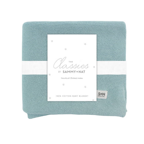 Light blue baby blanket with a white label featuring 'Sammy + Nat' branding on a white background.