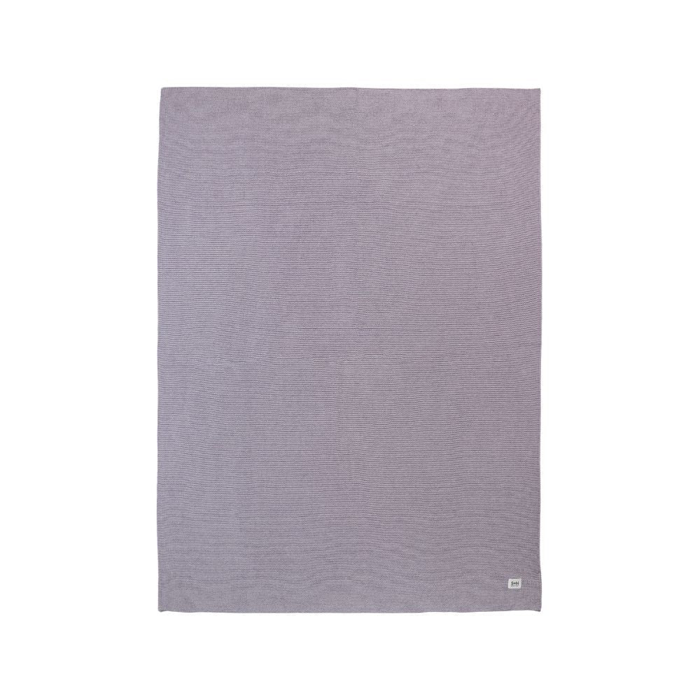 Purple textured blanket on a white background