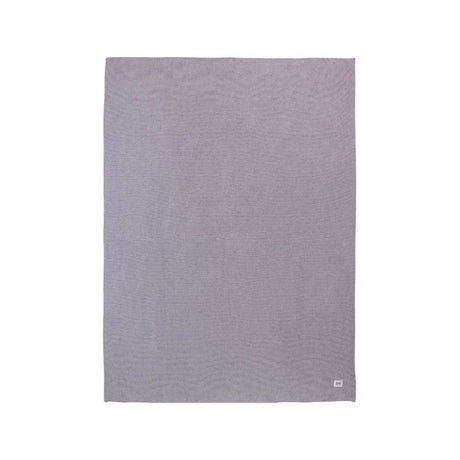 Purple textured blanket on a white background