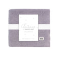 Purple baby blanket with a white label on a white background