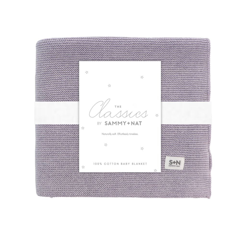 Purple baby blanket with a white label on a white background