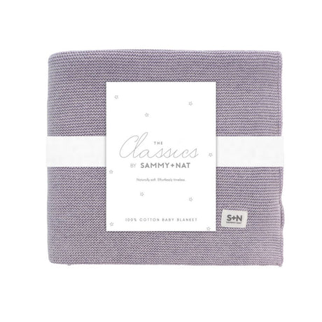 Purple baby blanket with a white label on a white background