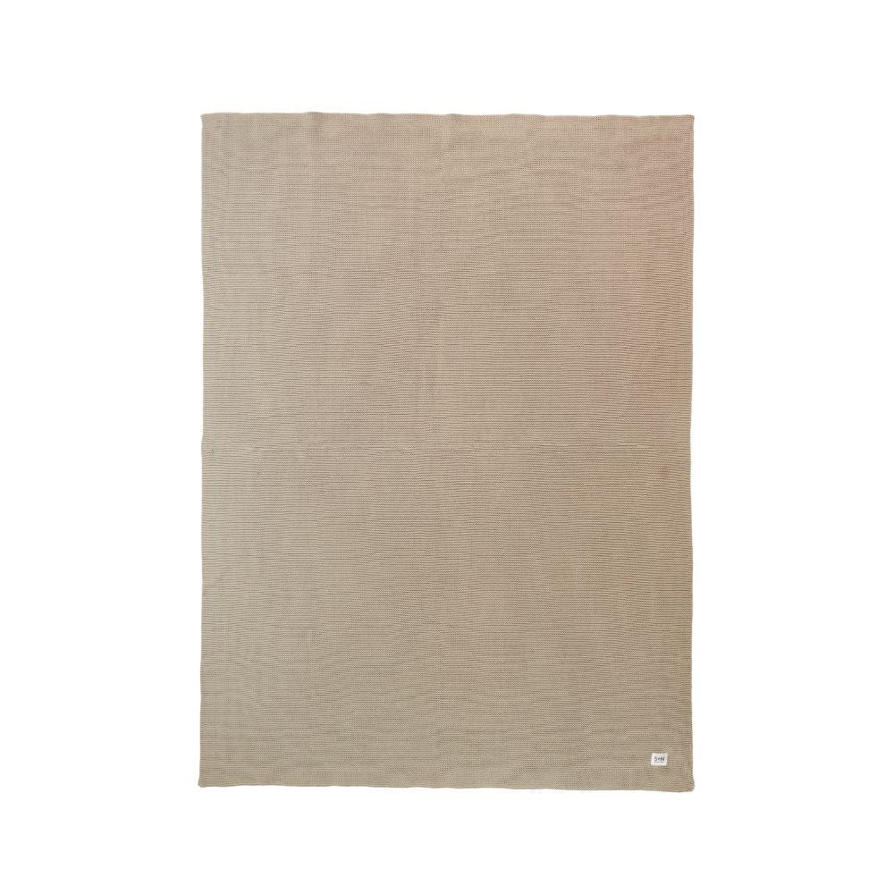 Beige blanket with a subtle pattern on a white background