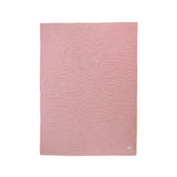 Pink textured blanket on a white background