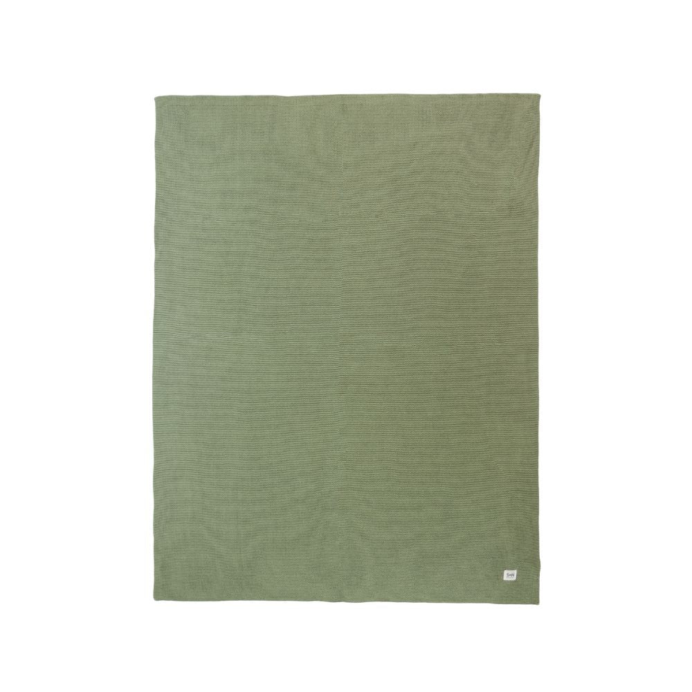 Green blanket on a white background
