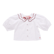 White blouse with red embroidery on a white background