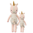 Two unicorn dolls, one larger and one smaller, on a white background