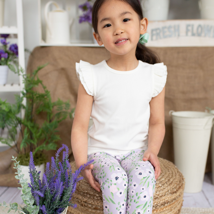 a little girl wearing Teagan Legging in Lavender Flowers