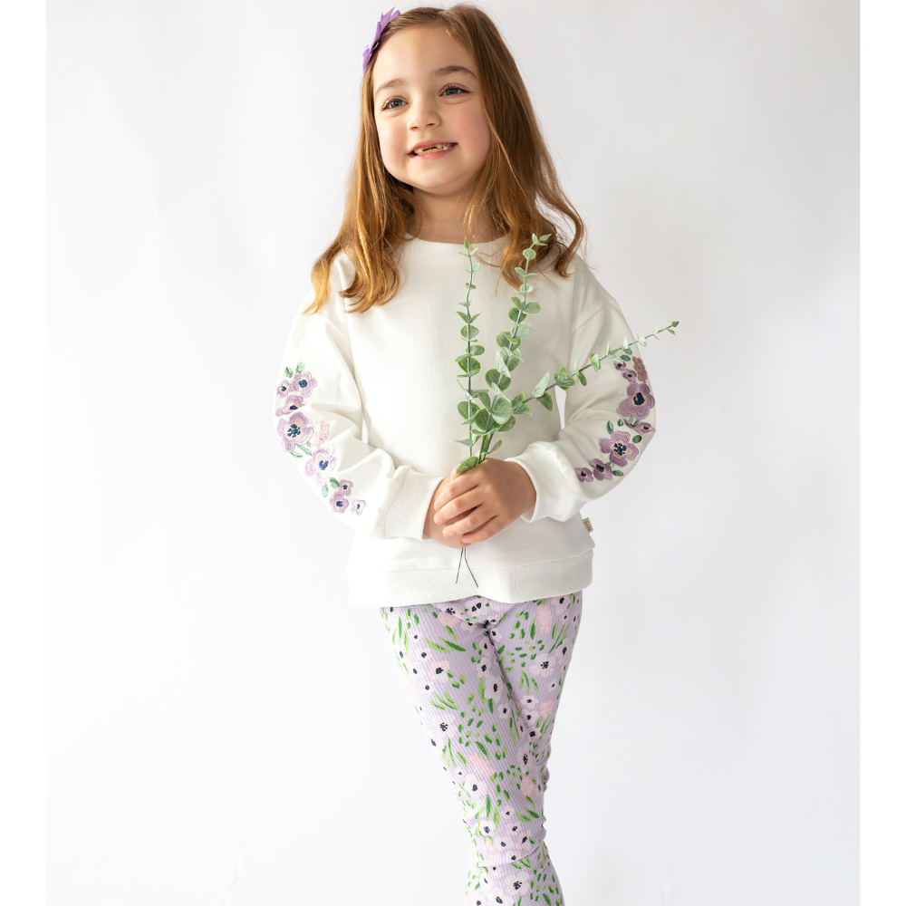 a girl wearing Teagan Legging in Lavender Flowers