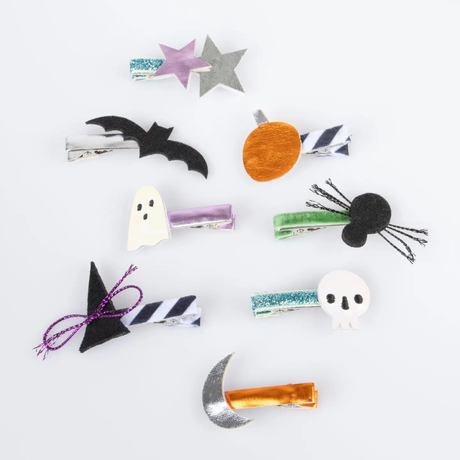 Halloween-themed hair clips on a white background