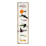 Decorative Halloween-themed magnetic strip with various icons on a white background