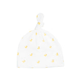 White baby hat with yellow duck pattern on a white background