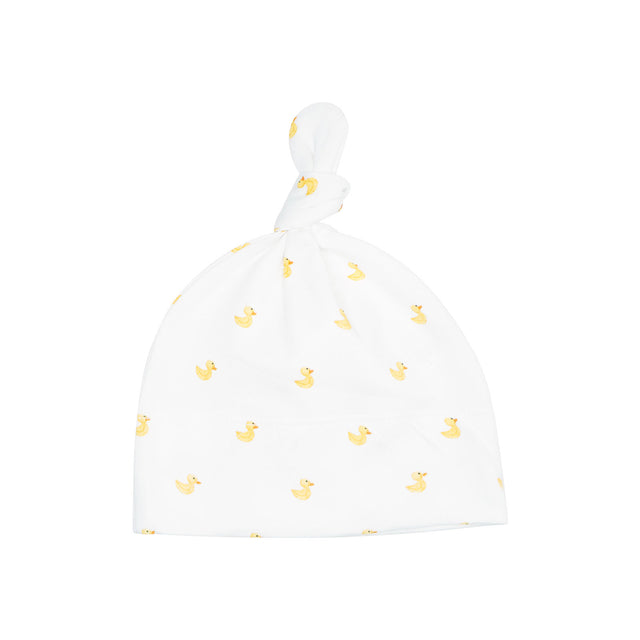 White baby hat with yellow duck pattern on a white background