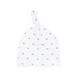 White baby hat with purple heart patterns on a white background
