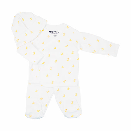 White baby onesie with yellow patterns on a white background