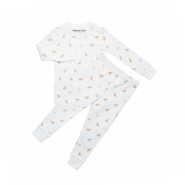 White baby outfit with long-sleeve top and pants featuring small animal prints on a white background.