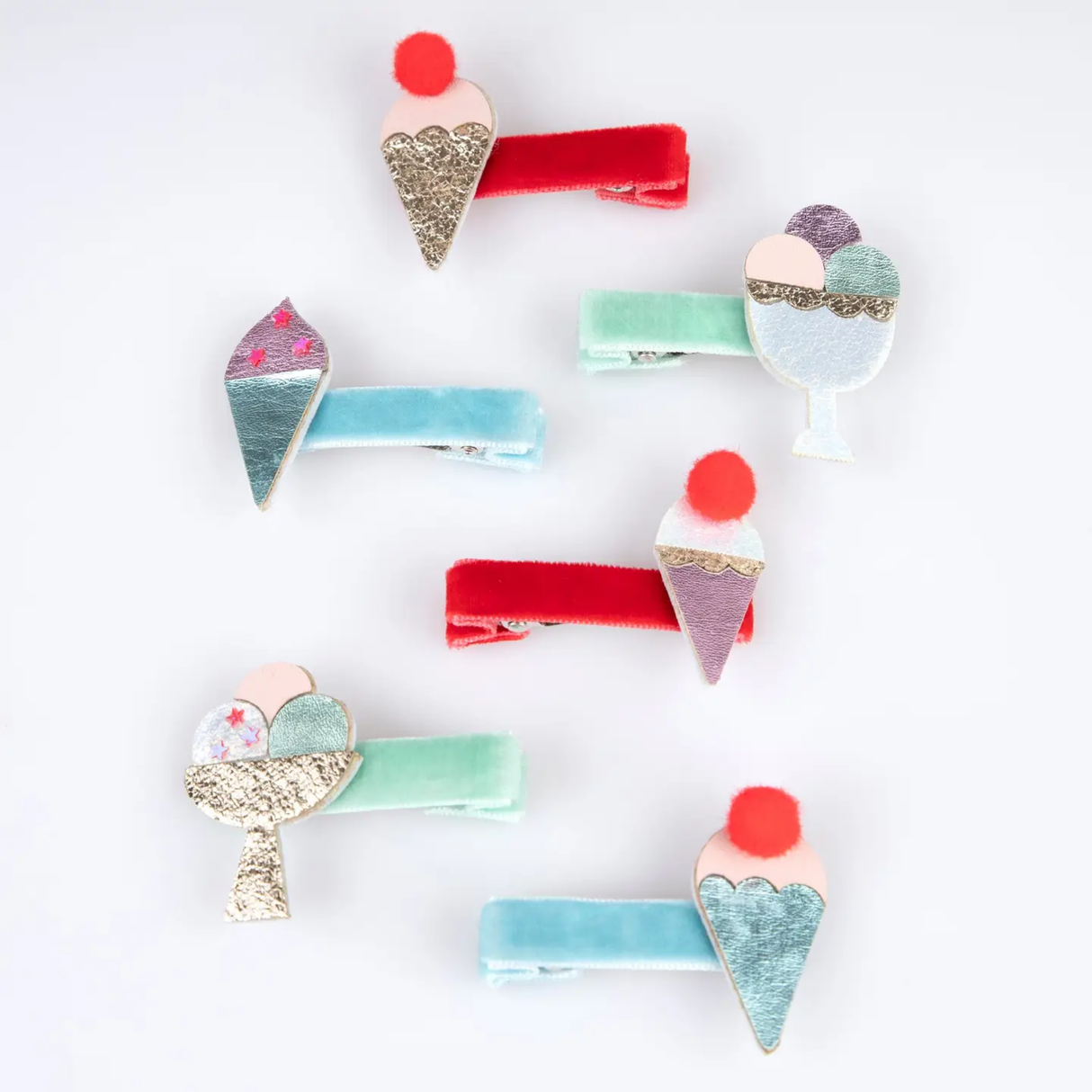 Colorful ice cream-themed hair clips on a white background