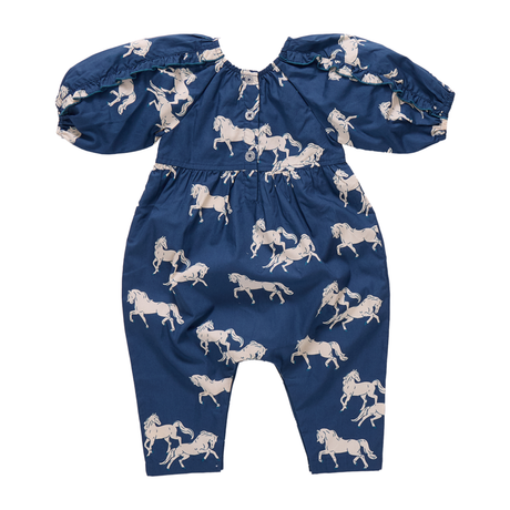 Blue romper with white horse pattern on a white background