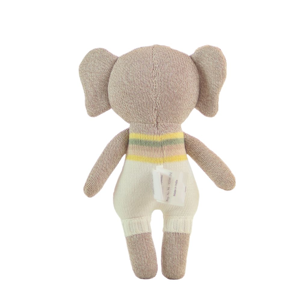 Knitted toy elephant with a striped sweater on a white background